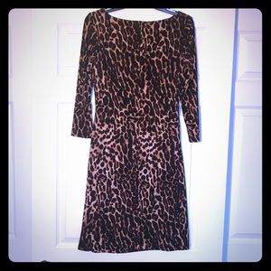 Animal print dress, lined and ruched.